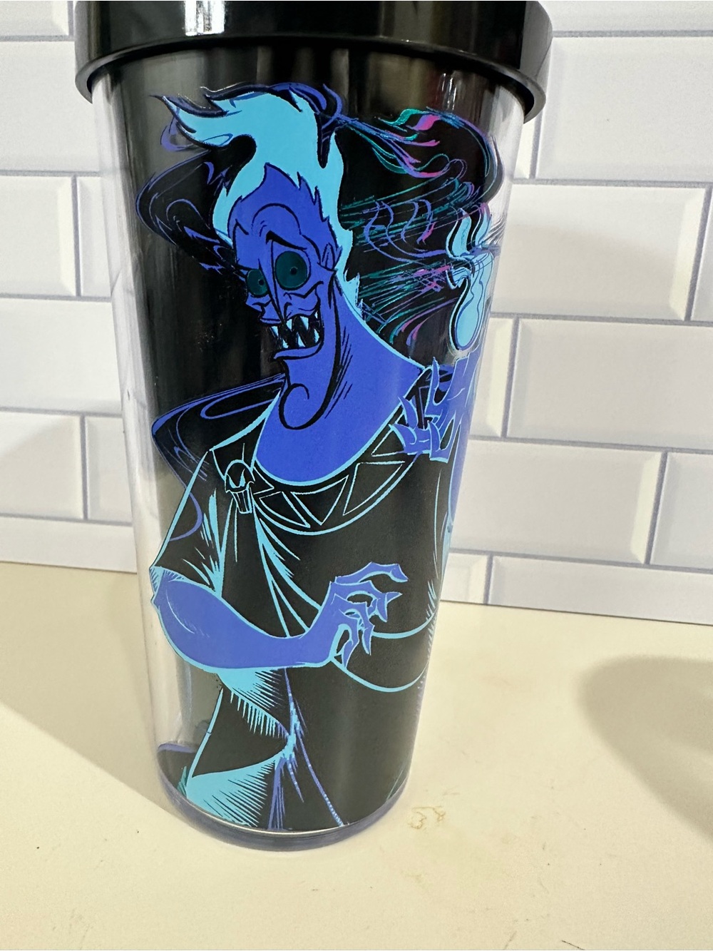 Hades Black Tumbler with Neon Blue Character Graphic